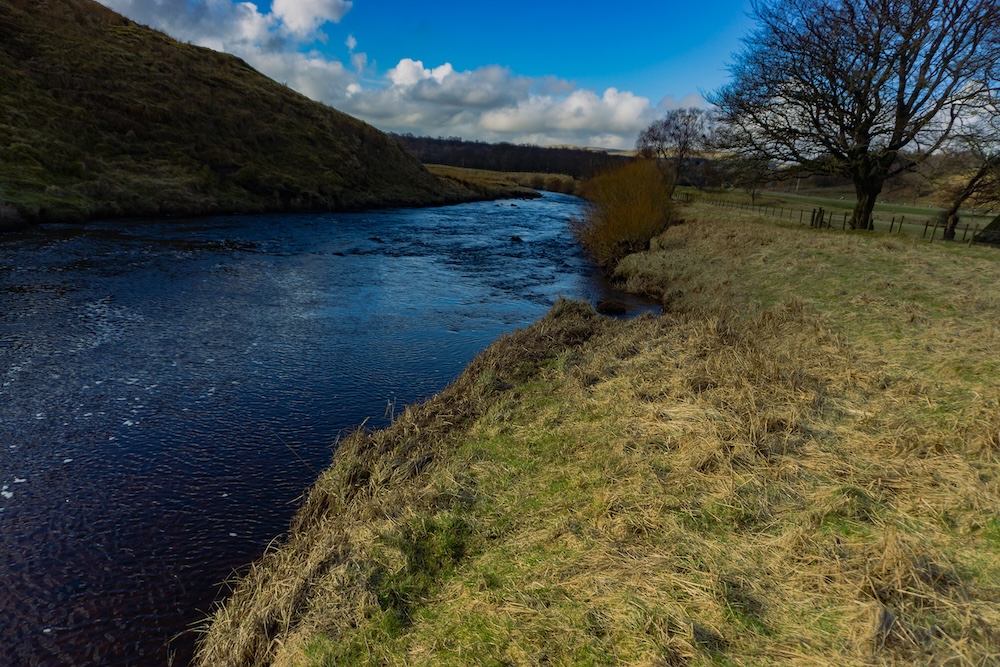 The River Ayr flowing through the landscape near Glenbuck